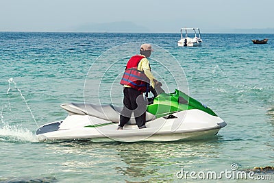 man on a water motorcycle on the sea Editorial Stock Photo