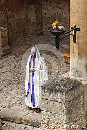 A man wearing ancient roman priest costume inside an ancient roman bath Editorial Stock Photo