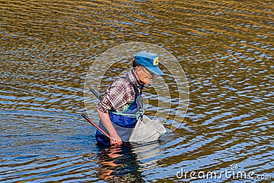 Man wearing blue waders in Kumgang river Editorial Stock Photo