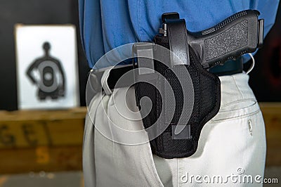 Man wearing a handgun in a webbing holster Stock Photo