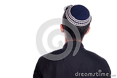 Man wearing kipa seen from the back, white background. religious person seen from behind. Stock Photo