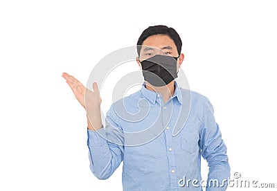 A man wearing a mask makes an explanatory gesture in front of a white background Stock Photo