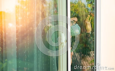 A man wearing a medical mask and quarantine recovery from illness at home. Stock Photo