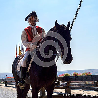 Man wearing medieval costume riding on a horse Editorial Stock Photo