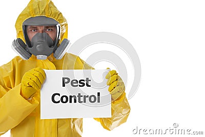 Man wearing protective suit holding sign PEST CONTROL on white background Stock Photo