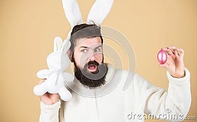 Man wearing rabbit suit. Funny bunny man soft ears. Easter activities concept. Weirdo concept. Celebrate Easter. Guy Stock Photo