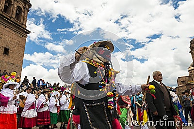 Man wearing traditional clothes and masks dancing the Huaylia in the Christmas day in front of the Cuzco Cathedral in Cuzco, Peru. Editorial Stock Photo