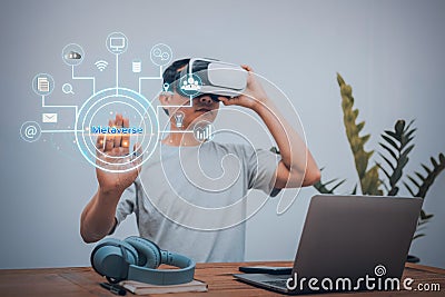 Man wears virtual reality glasses in Metaverse to link information online Stock Photo