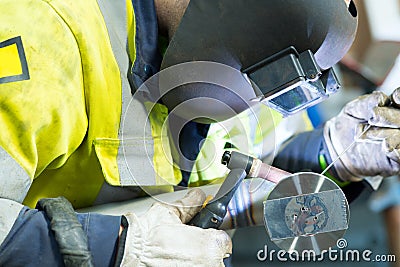 man in welders mask at work Stock Photo