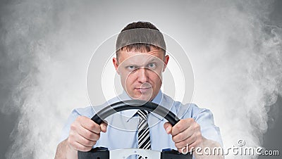 Man with the wheel in the smoke Stock Photo