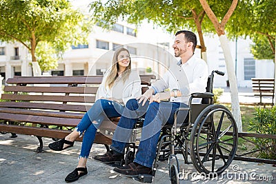 Man in wheelchair with his girlfriend Stock Photo