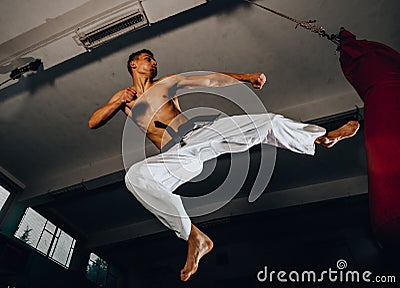 Muscular strong man on background boxing gym Stock Photo