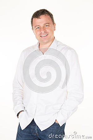 Man in white shirt hands in pocket jeans Stock Photo