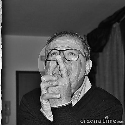 man who humorously begs, black and white photography. Stock Photo