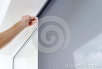 Man with window blind. Stock Photo