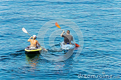 Man and Woman Kayaking in the Blue Water of the Sea - Liguria Italy Editorial Stock Photo