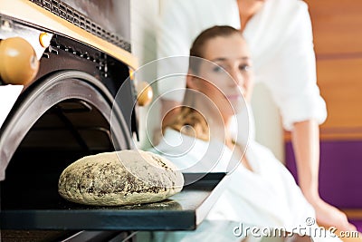 Man and woman in a bread sauna Stock Photo