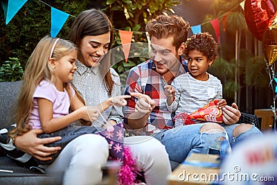 Man and woman with children playing Stock Photo