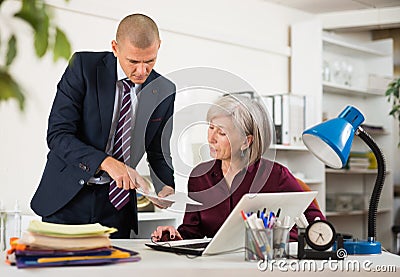 Man and woman clerical workers in office Stock Photo