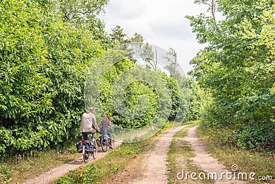 Man and woman cycling in a large nature reserve Editorial Stock Photo