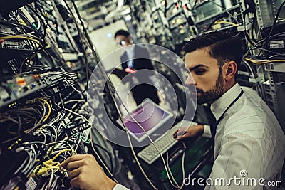 Man and woman in data centre Stock Photo