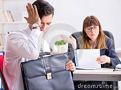 Man and woman discussing in office Stock Photo