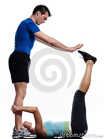 Man and woman doing abdominals workout push ups Stock Photo