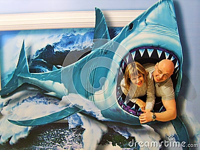 A man and a woman drawn in the jaws of a shark Editorial Stock Photo