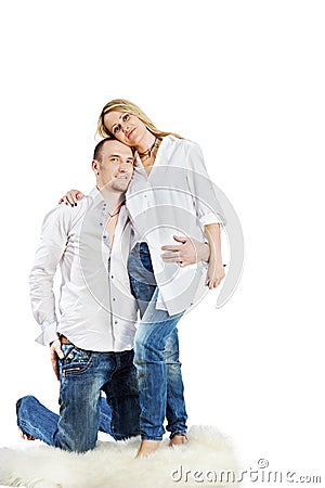 Man and woman embrace on carpet Stock Photo