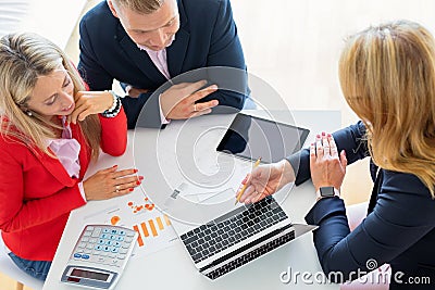 Man and woman getting help from professional financial consultant Stock Photo