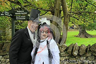 Man and woman in ghoulish costume,celebrating Halloween,Bunratty Castle and Folk Park,County Clare,Ireland,October,2014 Editorial Stock Photo