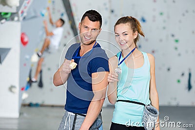 Man and woman with gold medals Stock Photo