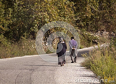 Man and woman hikers trekking roads in Turkey Stock Photo