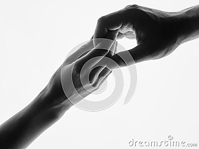 Man woman hold hands silhouette white background. Couple Holding Hands Closeup. Black and white photo Stock Photo