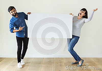 Man and woman holding blank board copyspace Stock Photo
