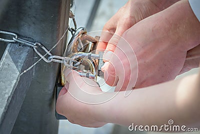 Man and woman locking a lock on a wedding day Stock Photo