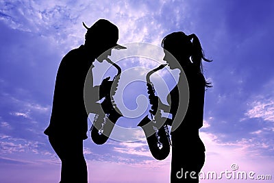 Man and woman play the saxophone Stock Photo