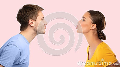 Man and woman reaching to each other trying to kiss Stock Photo