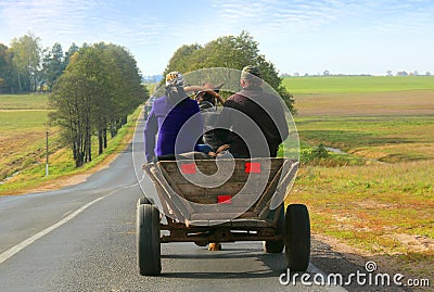 Man and woman riding in a carriage Editorial Stock Photo