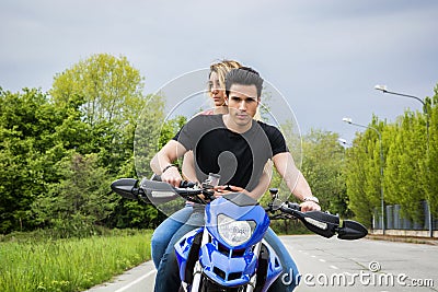 Man and woman riding motorcycle Stock Photo