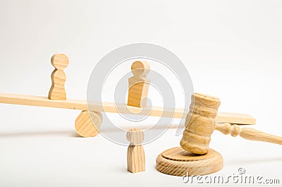 A man and a woman on the scales and a child near the hammer of a judge. The concept of conflict between parents. Parenting a child Stock Photo