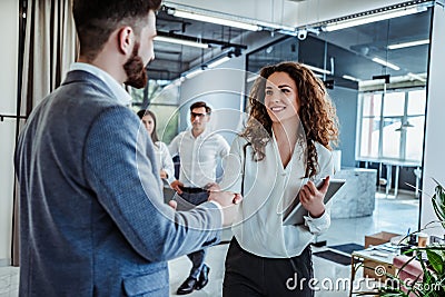 Man and woman are shaking hands in office. Collaborative teamwork.Business professionals Stock Photo