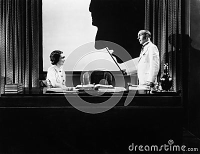 Man and woman with silhouette of huge nose Stock Photo