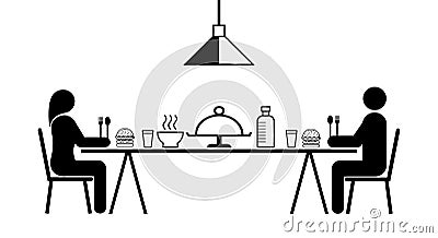 Man and woman sitting and eating together, two meters apart in the dining room, Eating together in accordance with social Stock Photo