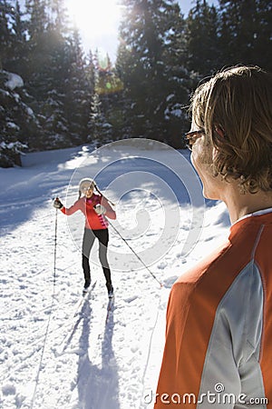 Man and Woman Snow Skiing Stock Photo