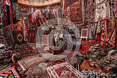 Man and woman in the store. Couple in love in Turkey. Man and woman in the Eastern country. Gift shop. A couple in love travels. Stock Photo