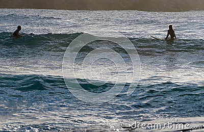 Man and Woman Waiting to Surf a Wave Editorial Stock Photo
