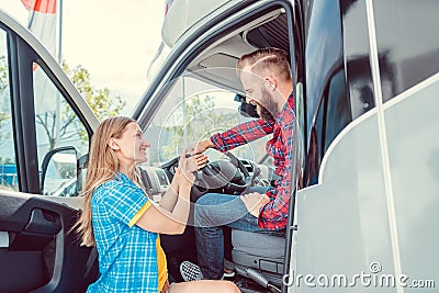 Man and woman testing a camper van or RV Stock Photo