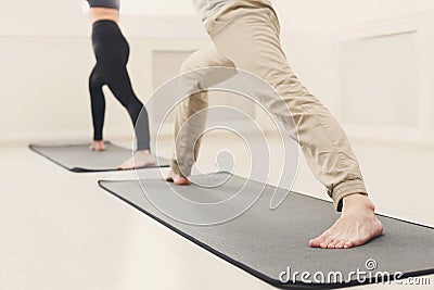 Man and woman warmup stretching training indoors Stock Photo