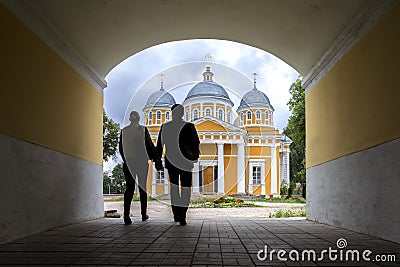 A man and a woman on the way to the Church in Tver, Russia Stock Photo